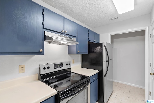 kitchen featuring blue cabinetry, light tile patterned flooring, a textured ceiling, and appliances with stainless steel finishes