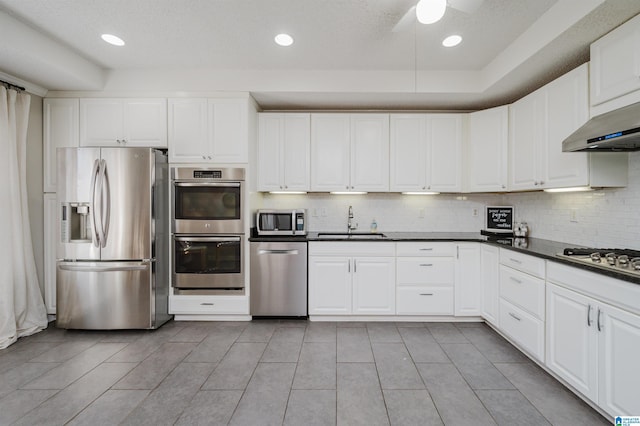 kitchen featuring sink, white cabinets, and appliances with stainless steel finishes