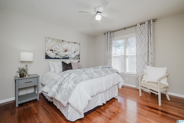 bedroom featuring ceiling fan and dark wood-type flooring