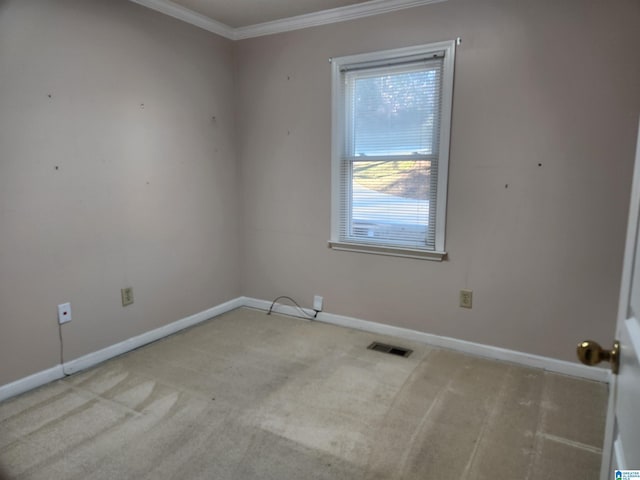 empty room with light carpet and ornamental molding