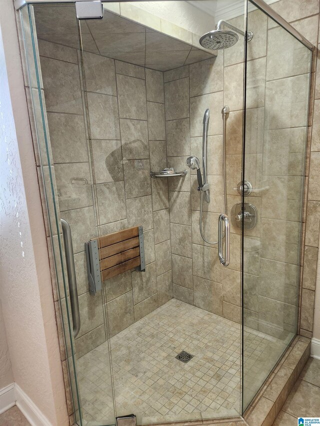 bathroom with a shower with shower door