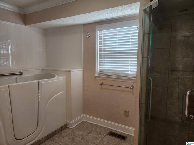 bathroom featuring tile patterned floors, an enclosed shower, and ornamental molding