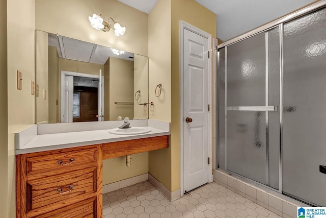 bathroom featuring tile patterned floors, walk in shower, and sink