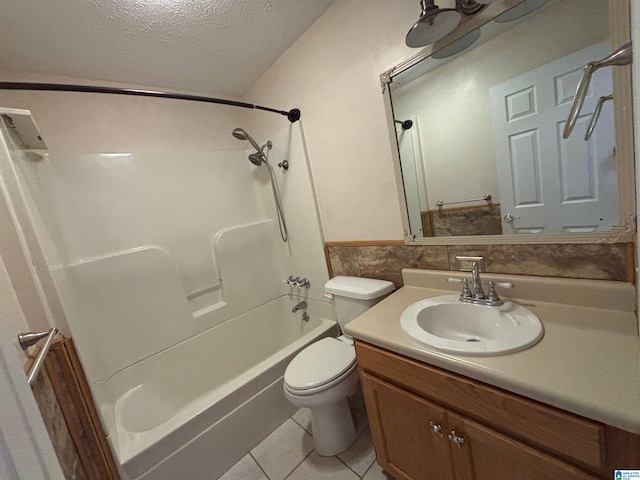 full bathroom featuring vanity, tile patterned flooring, a textured ceiling, toilet, and shower / bathing tub combination