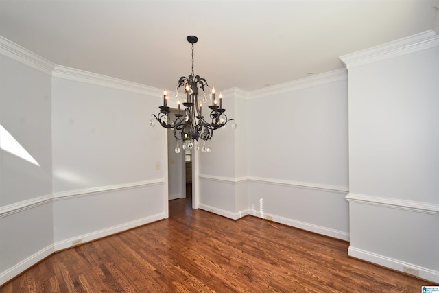 unfurnished dining area featuring a notable chandelier, dark hardwood / wood-style flooring, and crown molding