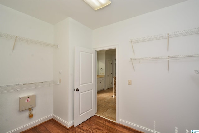 laundry room featuring dark hardwood / wood-style flooring