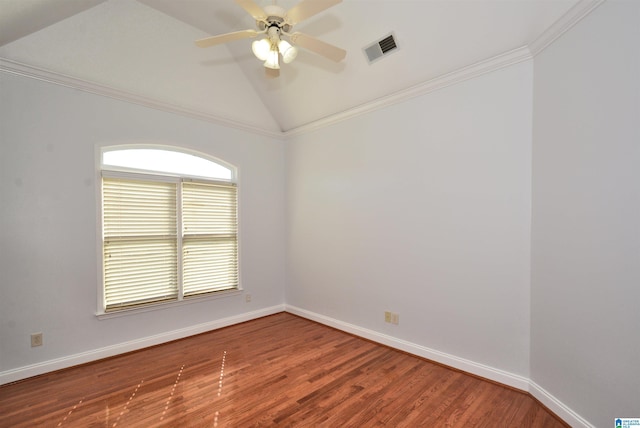 spare room featuring hardwood / wood-style floors, ceiling fan, crown molding, and vaulted ceiling