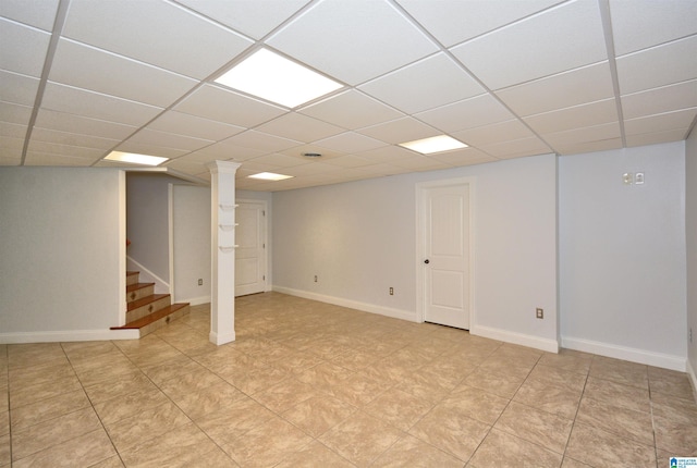 basement featuring a drop ceiling