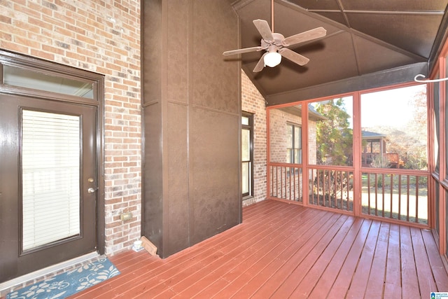 unfurnished sunroom featuring ceiling fan and lofted ceiling