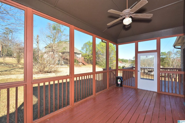 unfurnished sunroom with ceiling fan and a healthy amount of sunlight