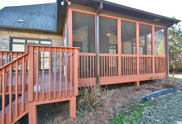 wooden deck featuring a sunroom