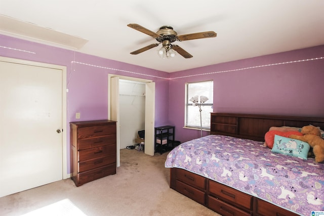 bedroom featuring a closet, light colored carpet, and ceiling fan