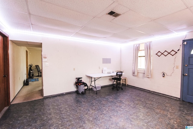 interior space featuring a paneled ceiling