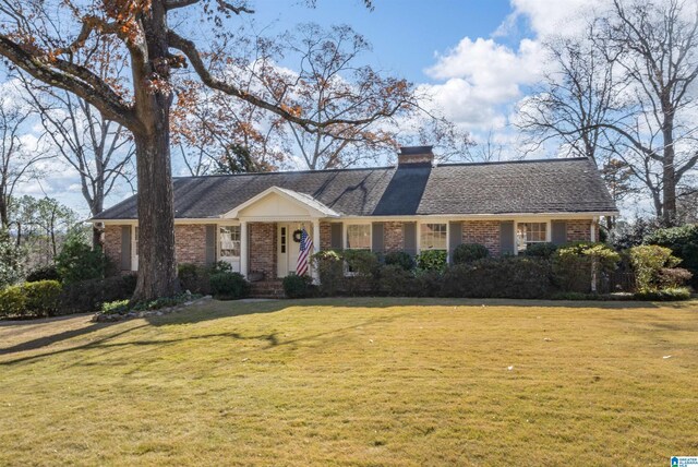 ranch-style home with a front lawn