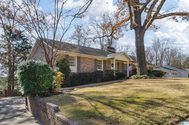 ranch-style house with a front lawn