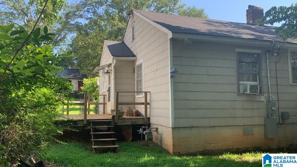 view of home's exterior featuring a wooden deck