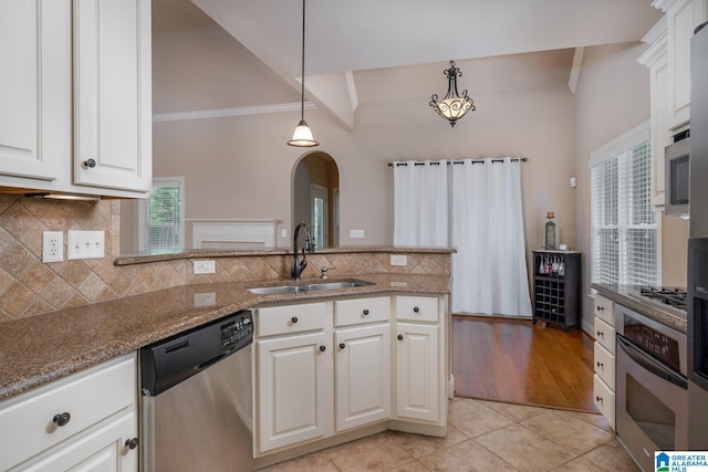 kitchen with sink, white cabinetry, and stainless steel appliances