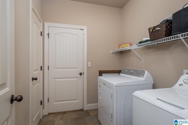 laundry room with washing machine and clothes dryer