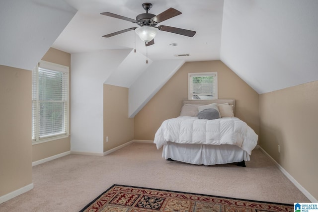 bedroom with ceiling fan, light carpet, and lofted ceiling