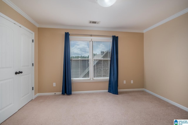 unfurnished room with light carpet and ornamental molding