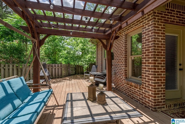 view of patio with outdoor lounge area, a deck, and a pergola