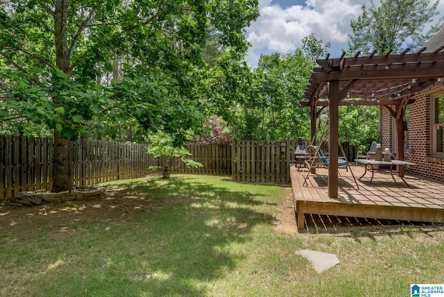 view of yard featuring a deck and a pergola