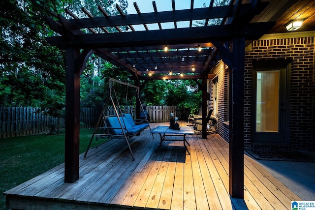 deck featuring a yard, a pergola, and an outdoor living space