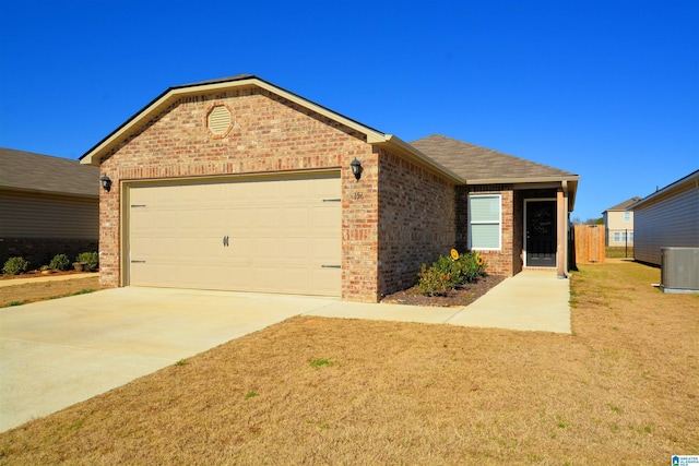 ranch-style home with central AC and a garage