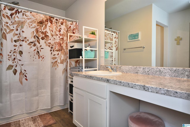 bathroom featuring shower / bathtub combination with curtain and vanity