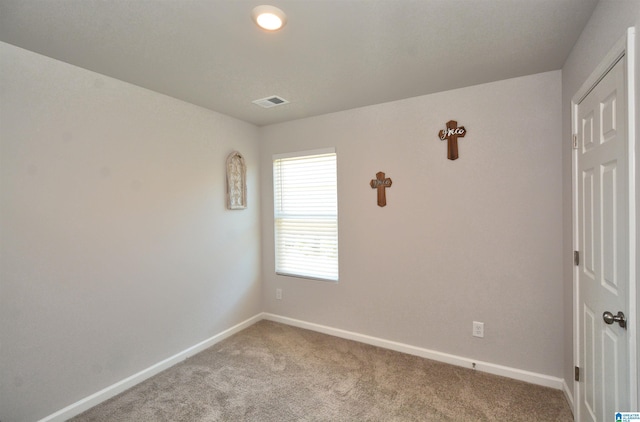 unfurnished room featuring carpet