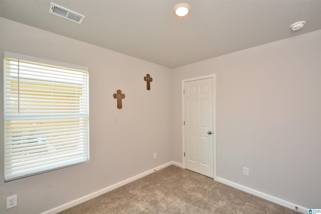 empty room with carpet flooring