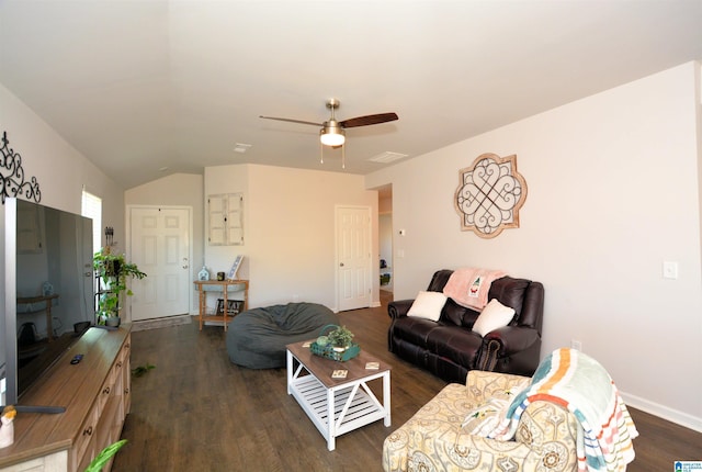 living room featuring dark hardwood / wood-style floors and ceiling fan