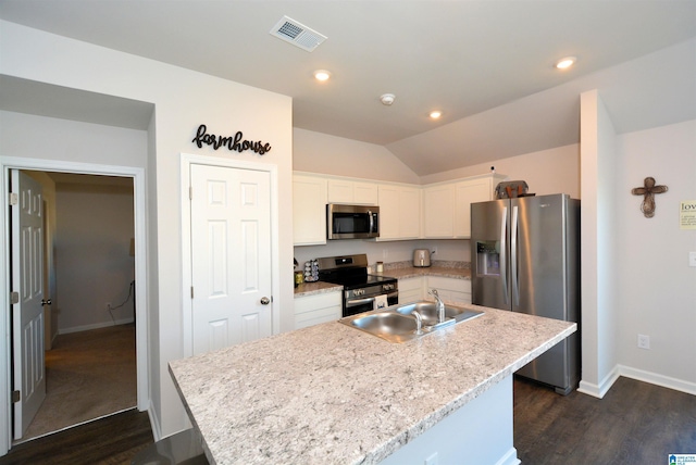 kitchen featuring white cabinetry, a center island with sink, stainless steel appliances, and sink