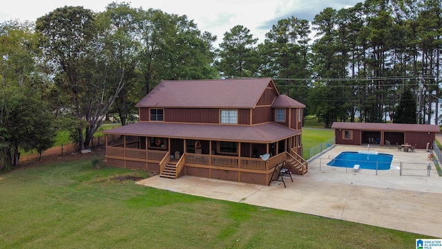 back of property featuring a yard and a patio