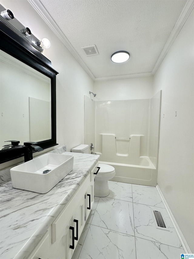 full bathroom with ornamental molding, vanity, a textured ceiling, washtub / shower combination, and toilet