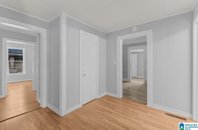 unfurnished bedroom featuring a closet and light hardwood / wood-style flooring