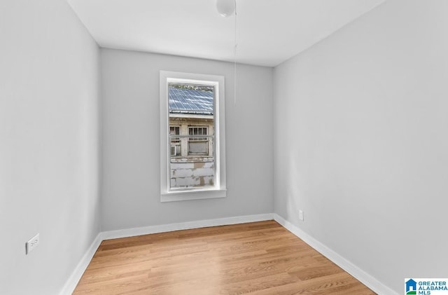 spare room with light hardwood / wood-style flooring