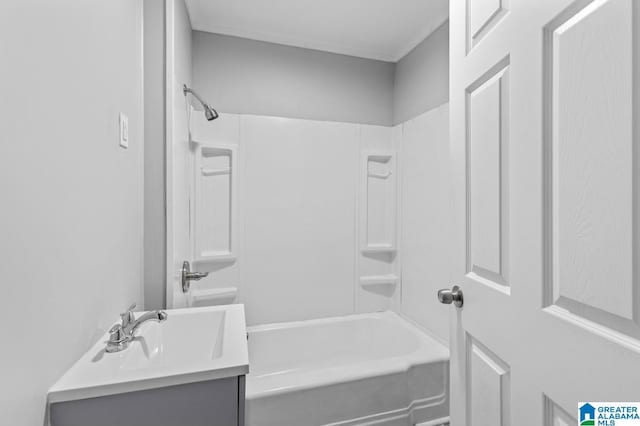 bathroom featuring shower / washtub combination and vanity