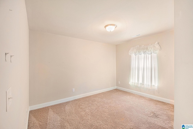 unfurnished room featuring carpet flooring