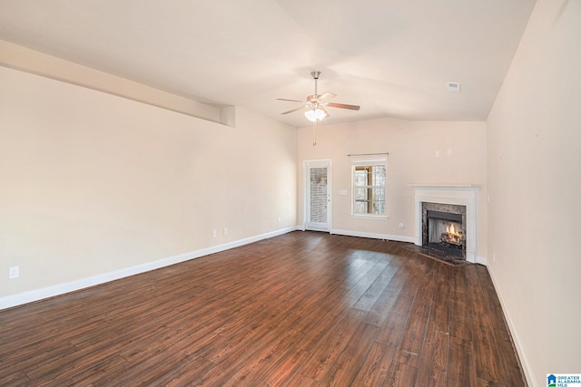 unfurnished living room with dark hardwood / wood-style flooring, vaulted ceiling, a premium fireplace, and ceiling fan