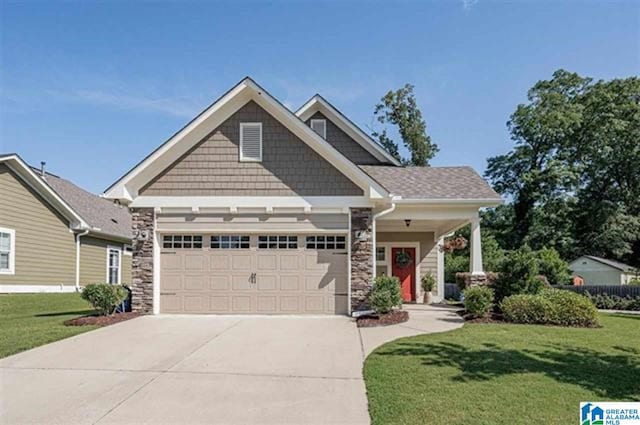 craftsman-style house with a front lawn and a garage