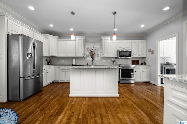 kitchen with pendant lighting, light stone counters, white cabinetry, and stainless steel appliances