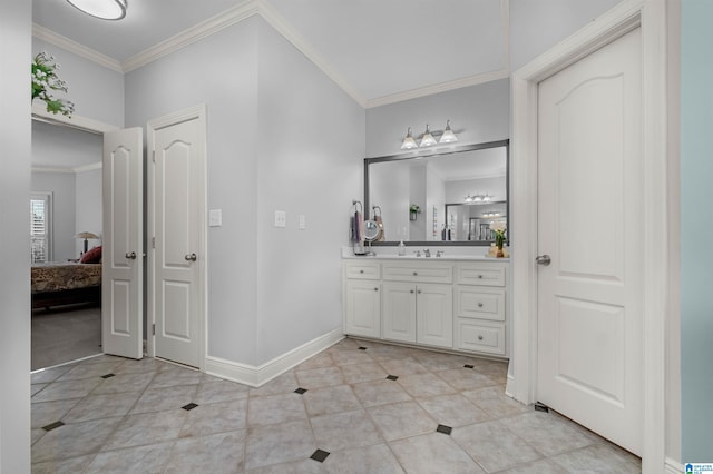 bathroom with tile patterned flooring, vanity, and ornamental molding