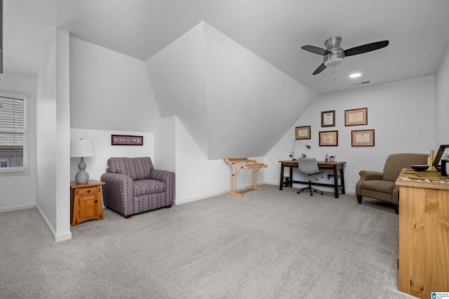 sitting room featuring ceiling fan, light carpet, and lofted ceiling