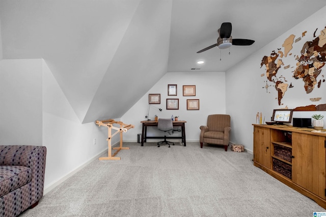 home office with ceiling fan, light carpet, and lofted ceiling