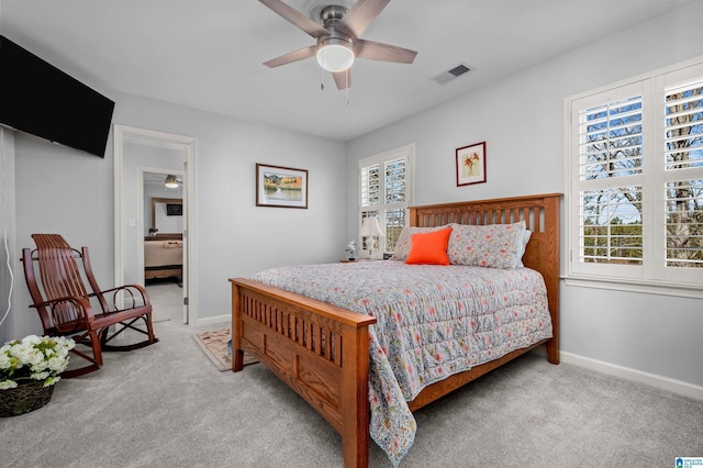 bedroom featuring ceiling fan and light carpet