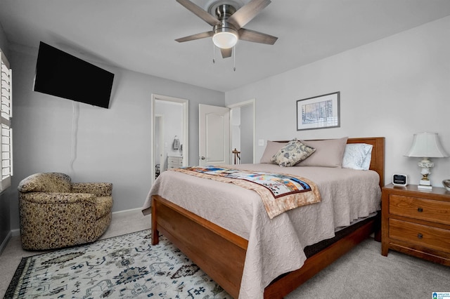 bedroom with ceiling fan and light carpet