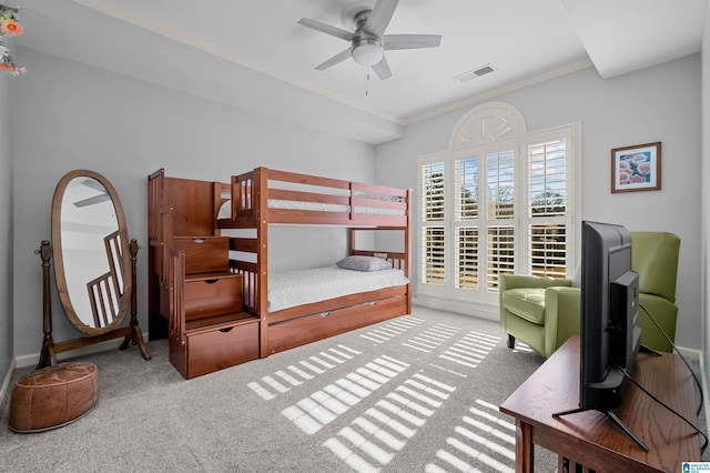 bedroom featuring ceiling fan, carpet, and ornamental molding