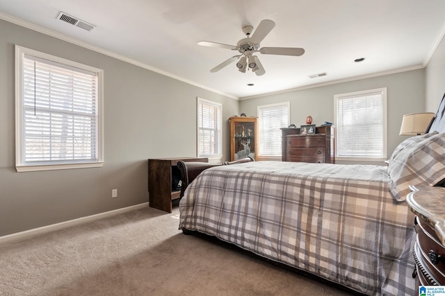 carpeted bedroom featuring multiple windows, ceiling fan, and ornamental molding