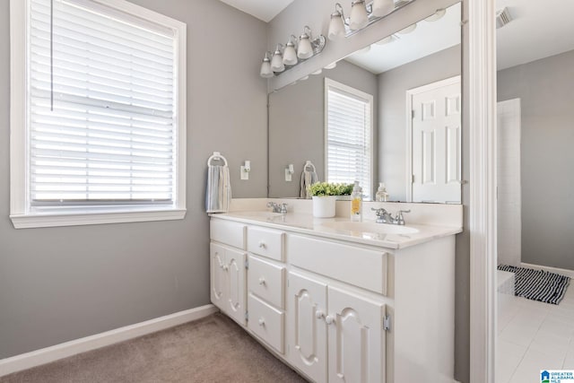 bathroom with vanity and plenty of natural light